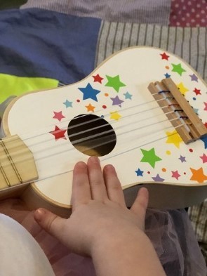 Children Playing Toy Guitar